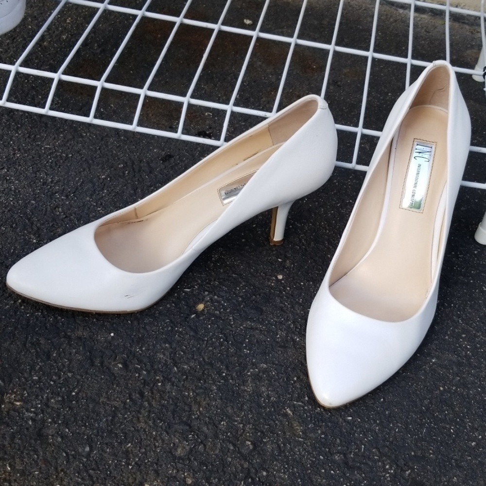 White pumps. Dress shoes. Hills